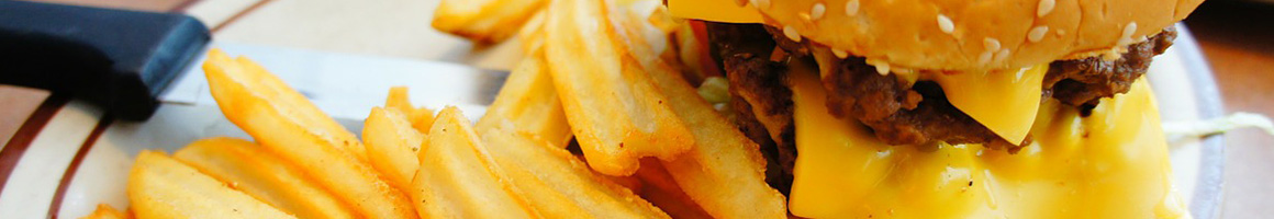 Eating American (New) Burger Hawaiian at South Shore Grill restaurant in Honolulu, HI.